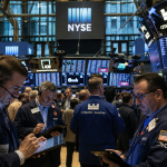 Dow edges higher as Intel slips despite earnings, Nasdaq dips